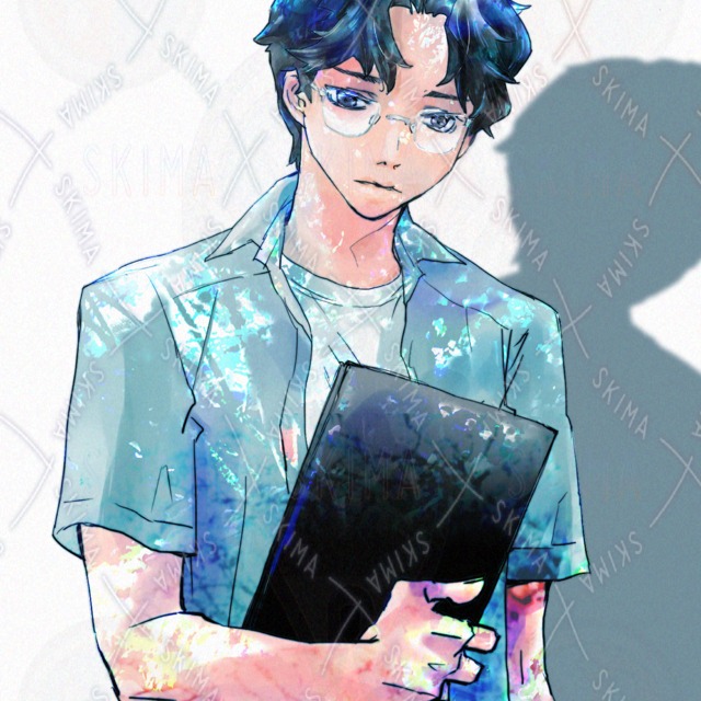木陰の男子学生